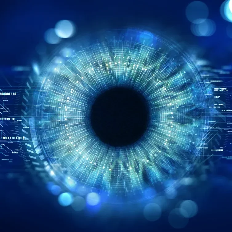 Close-up of a digital eye with data overlays and blue light effects.